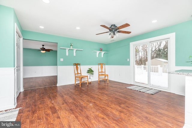 spare room featuring dark wood-type flooring and ceiling fan