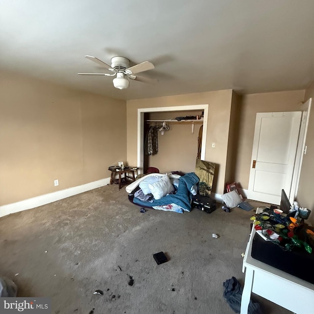 bedroom featuring ceiling fan, unfinished concrete flooring, and a closet