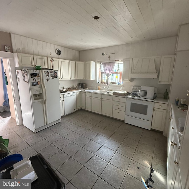 kitchen featuring white appliances, wood ceiling, custom exhaust hood, light countertops, and light tile patterned flooring