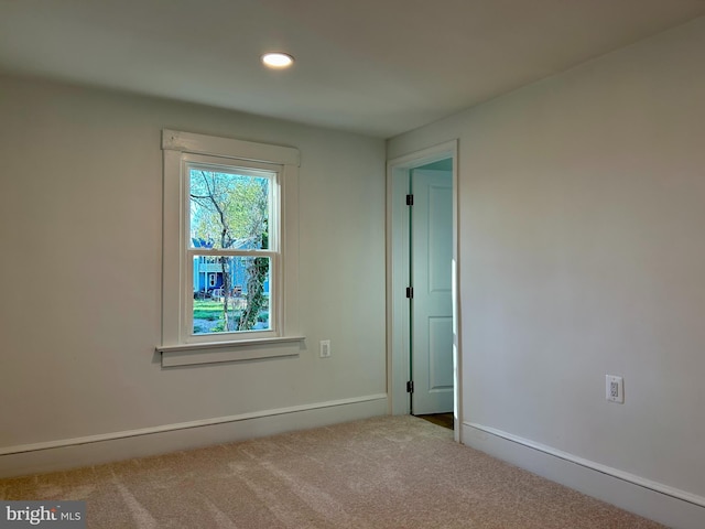 spare room featuring carpet floors