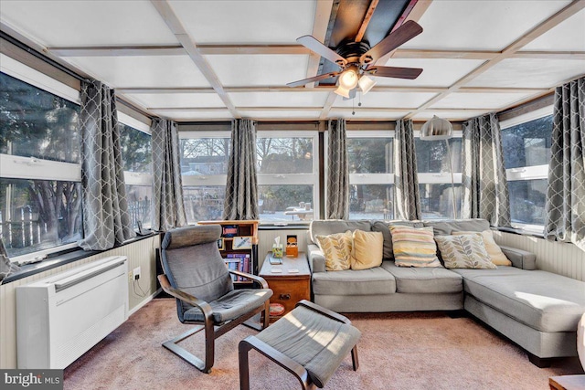 sunroom featuring ceiling fan