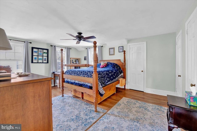 bedroom featuring wood-type flooring and ceiling fan