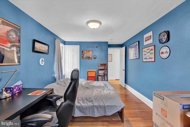 bedroom with light hardwood / wood-style floors