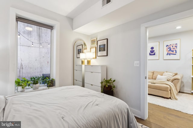 bedroom featuring wood-type flooring