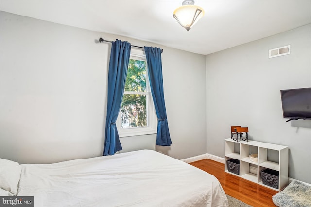 bedroom featuring wood-type flooring