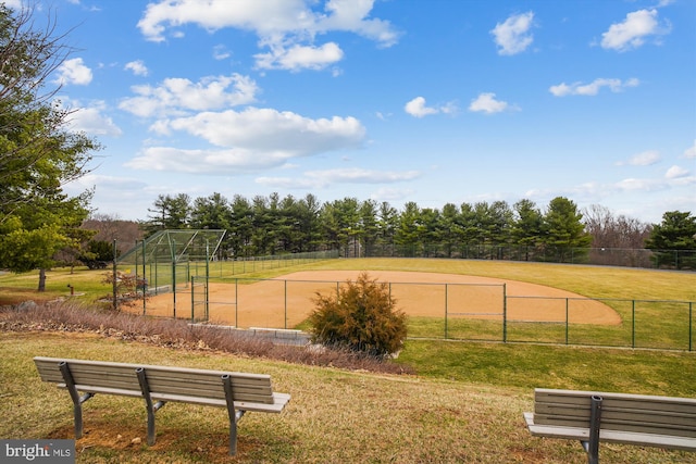 view of home's community with an outdoor structure and a lawn