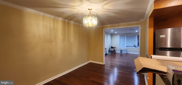 corridor featuring an inviting chandelier, dark hardwood / wood-style flooring, and crown molding