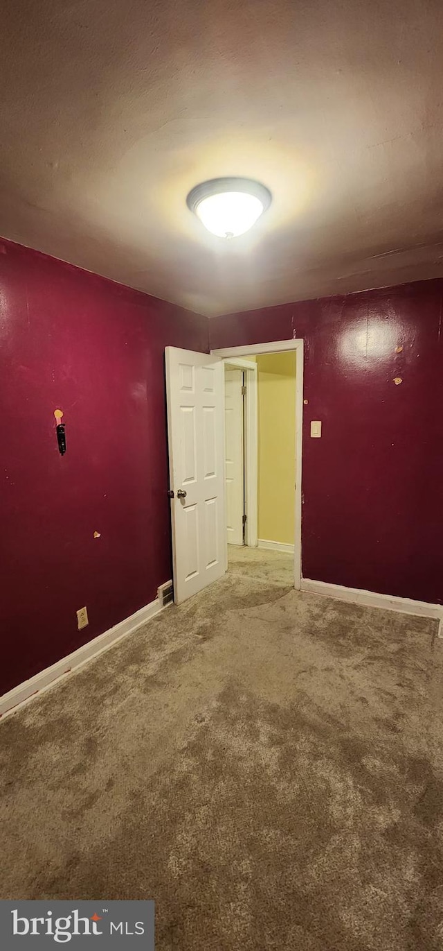 spare room featuring carpet