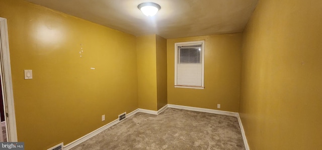 empty room with light colored carpet