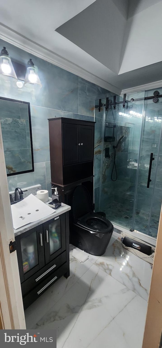 bathroom featuring walk in shower, toilet, crown molding, tile walls, and vanity