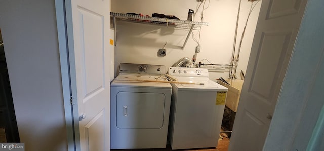 clothes washing area featuring washing machine and dryer