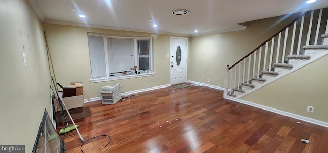 entryway featuring crown molding and hardwood / wood-style flooring