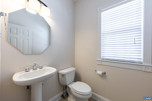 bathroom featuring sink and toilet