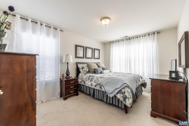 bedroom with light carpet