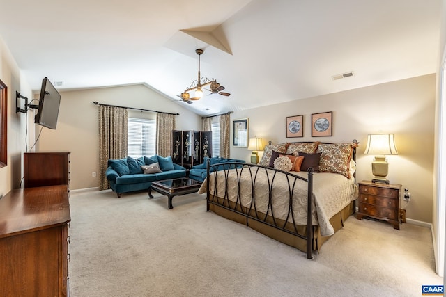 bedroom with light colored carpet and vaulted ceiling