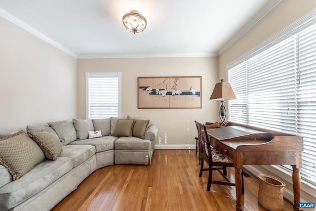 office space with crown molding and light wood-type flooring