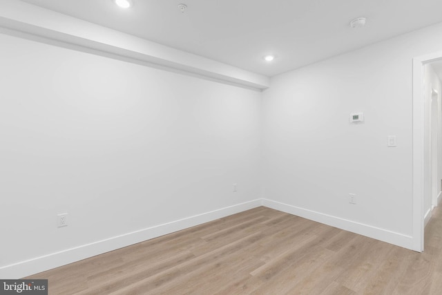 unfurnished room with light wood-type flooring