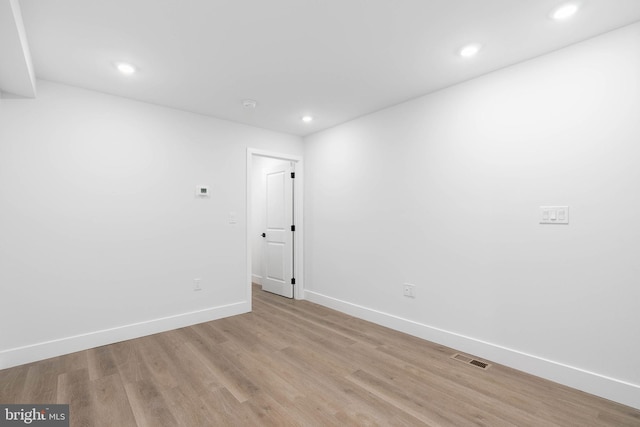 spare room with light hardwood / wood-style floors