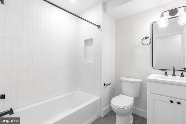 full bathroom with vanity, tiled shower / bath combo, and toilet