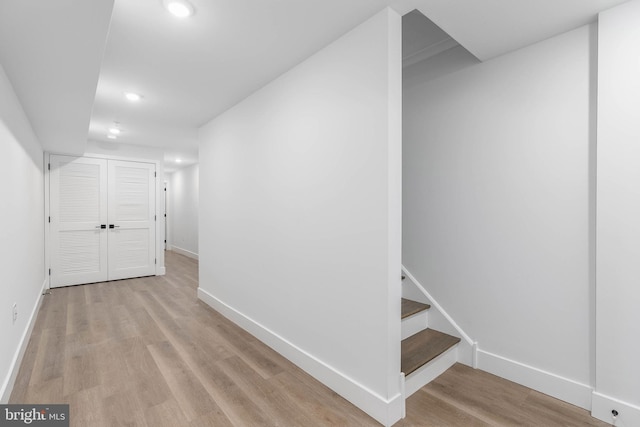 corridor featuring light hardwood / wood-style floors