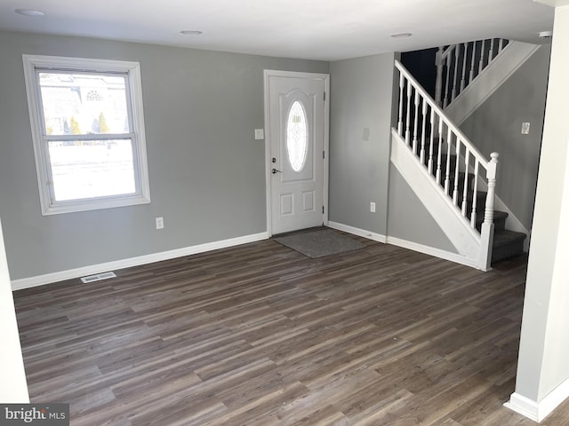 foyer entrance with dark hardwood / wood-style floors