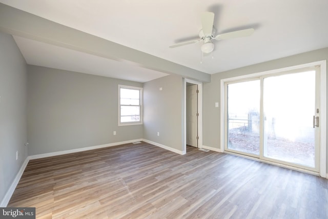 unfurnished room featuring light wood-type flooring and ceiling fan