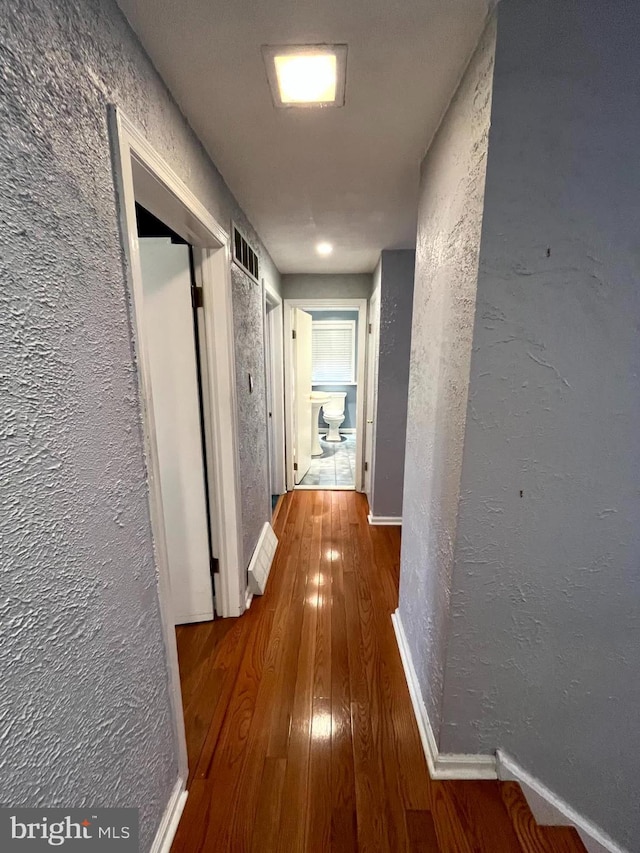 hallway featuring hardwood / wood-style floors