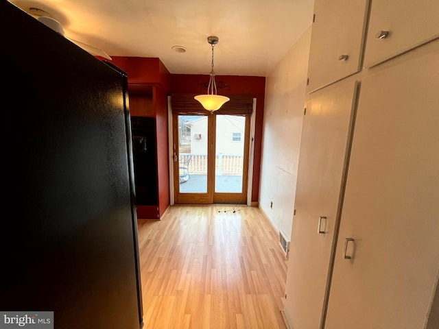 doorway featuring light hardwood / wood-style flooring