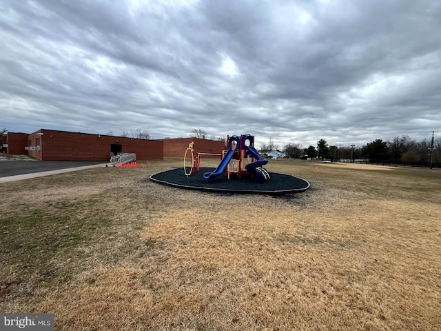 view of playground featuring a lawn