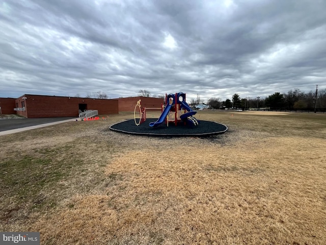 view of jungle gym with a lawn