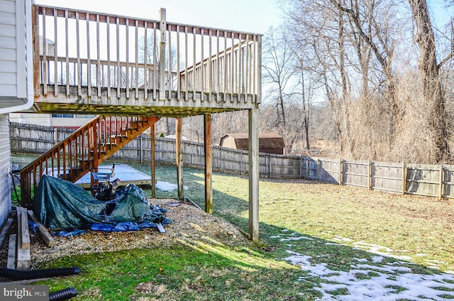 snowy yard featuring a wooden deck