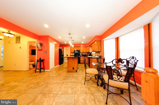 dining area featuring light tile patterned floors