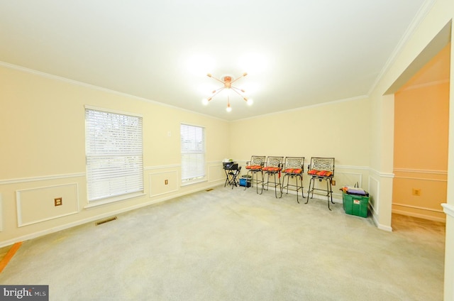 playroom featuring crown molding, carpet, and a notable chandelier