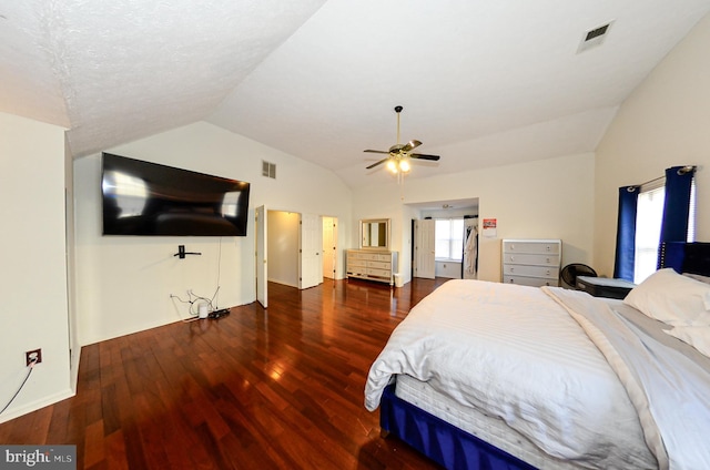 bedroom with lofted ceiling, dark wood-type flooring, and ceiling fan