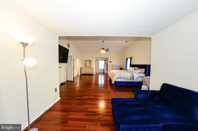 bedroom featuring lofted ceiling and dark hardwood / wood-style flooring