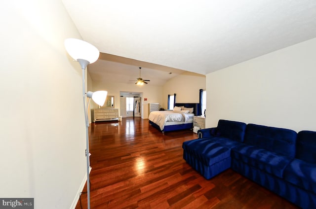 bedroom featuring lofted ceiling and hardwood / wood-style flooring