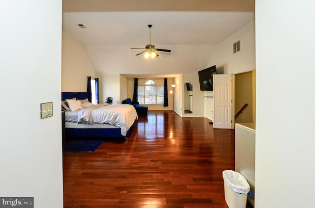 bedroom featuring dark hardwood / wood-style flooring and vaulted ceiling