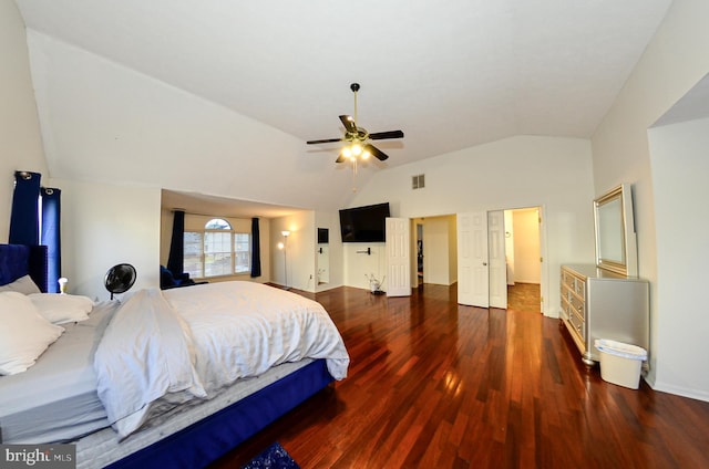 bedroom with vaulted ceiling, dark hardwood / wood-style floors, and ceiling fan