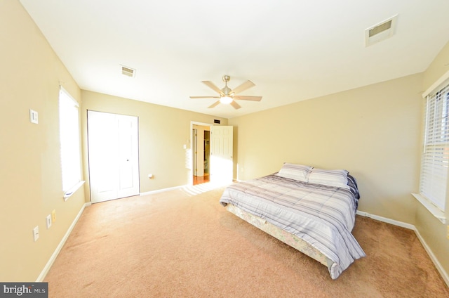 carpeted bedroom featuring ceiling fan