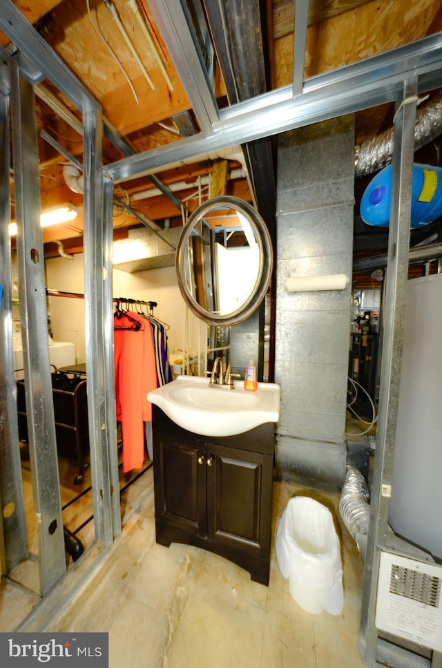 bathroom with vanity and concrete flooring