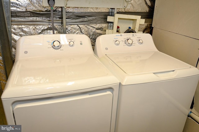 washroom featuring washer and clothes dryer