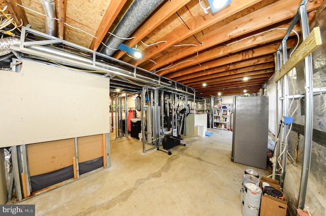 basement featuring stainless steel fridge