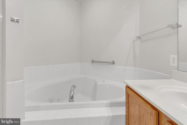 bathroom with a tub to relax in and vanity