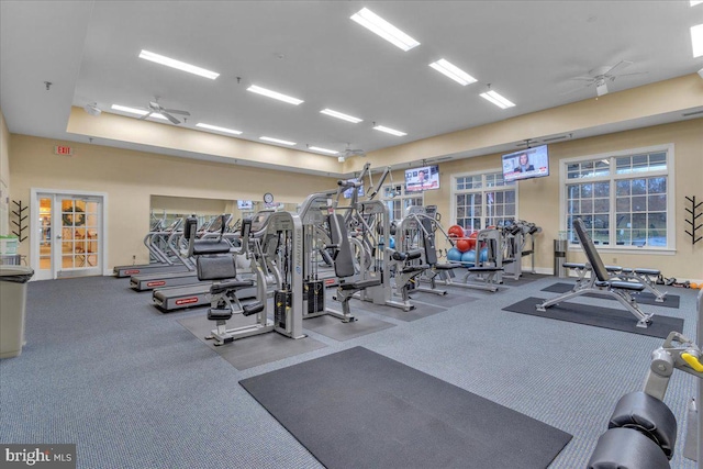 workout area with french doors and ceiling fan