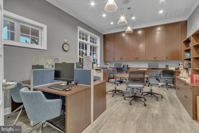 office with ornamental molding and light wood-type flooring