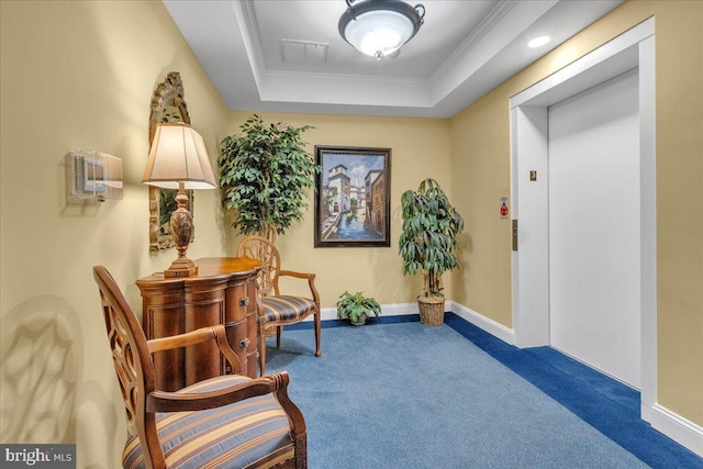 living area with crown molding, a raised ceiling, elevator, and carpet