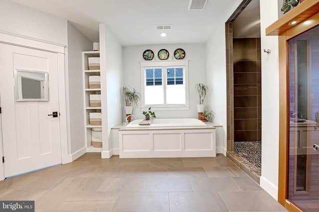 mudroom featuring light tile patterned flooring