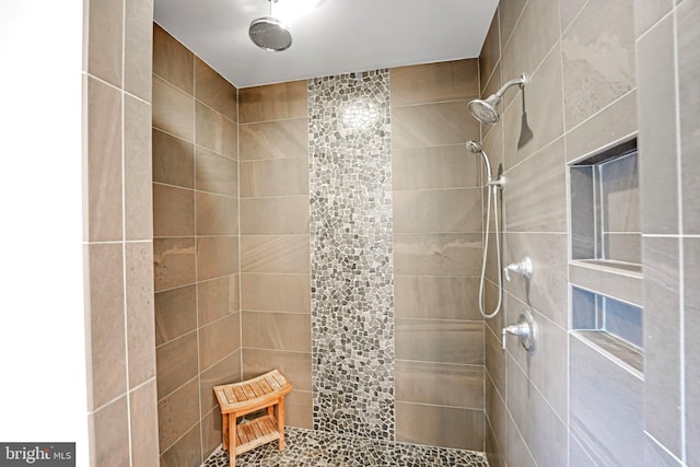 bathroom featuring tiled shower