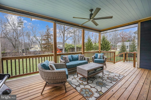 sunroom / solarium with ceiling fan