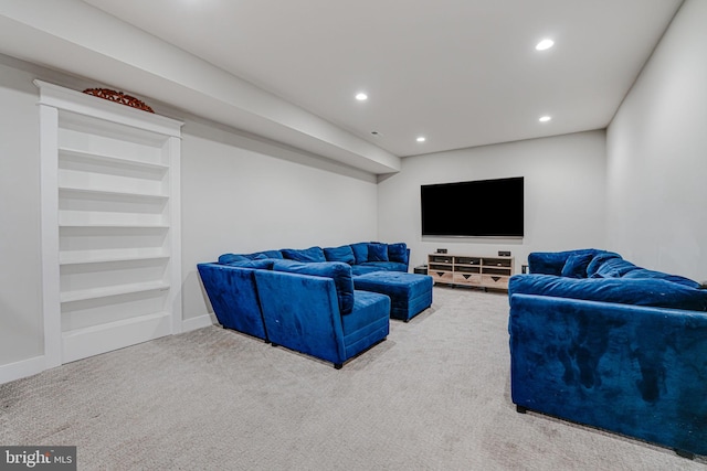 carpeted living room with built in features